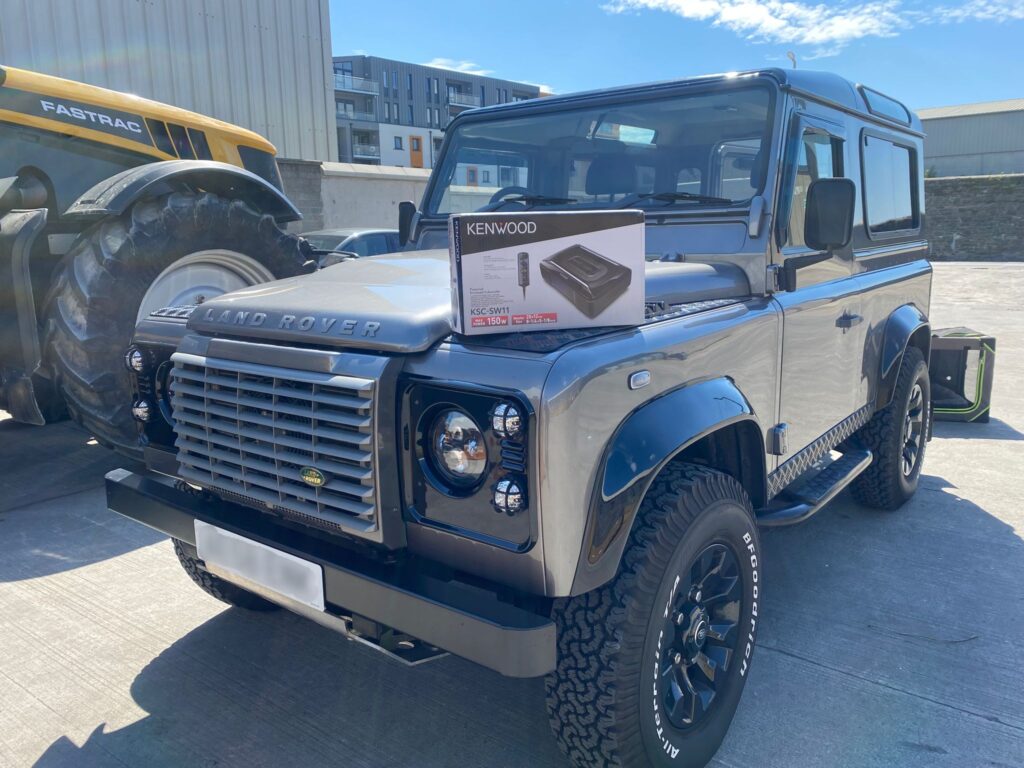 Cracking Land Rover Defender in for Bluetooth headunit and underseat subwoofer